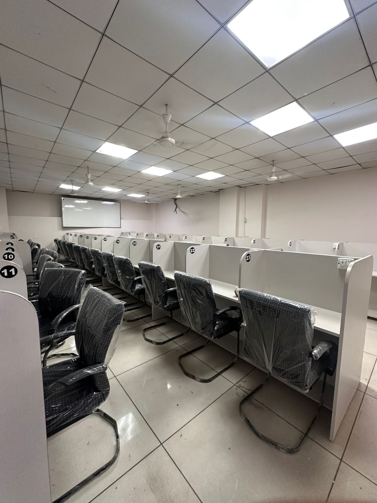 Mascot Education Hub library wide view with numbered study cubicles